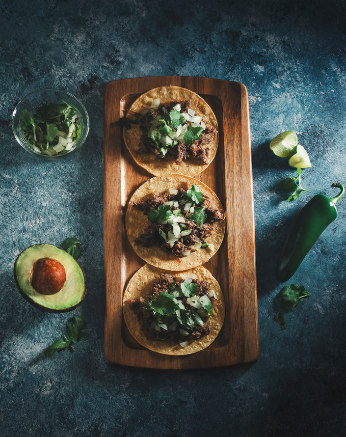 Tacos of Barbecue on Wood Serving Tray on Blue Background 